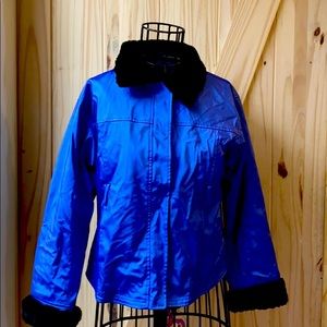 Thick comfy blue jacket with black fuzz at the end